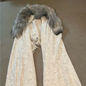 NWO tags Cabi wrap with faux fur trim.